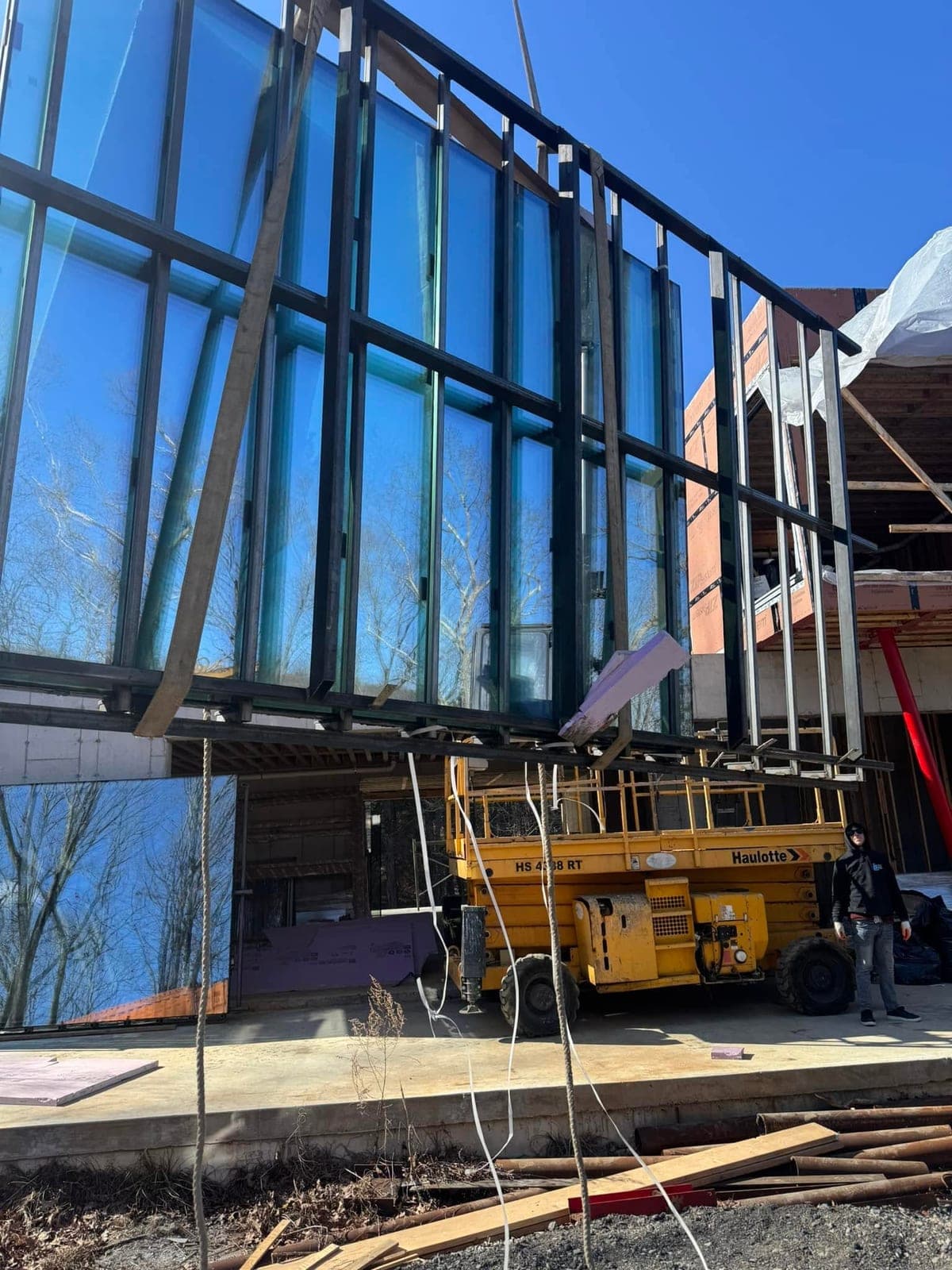 Large architectural glass curtain wall installed across a New York City building facade