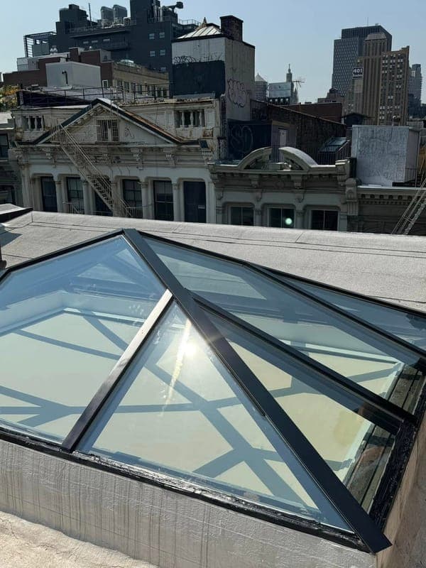 Rooftop skylights above the New York City skyline