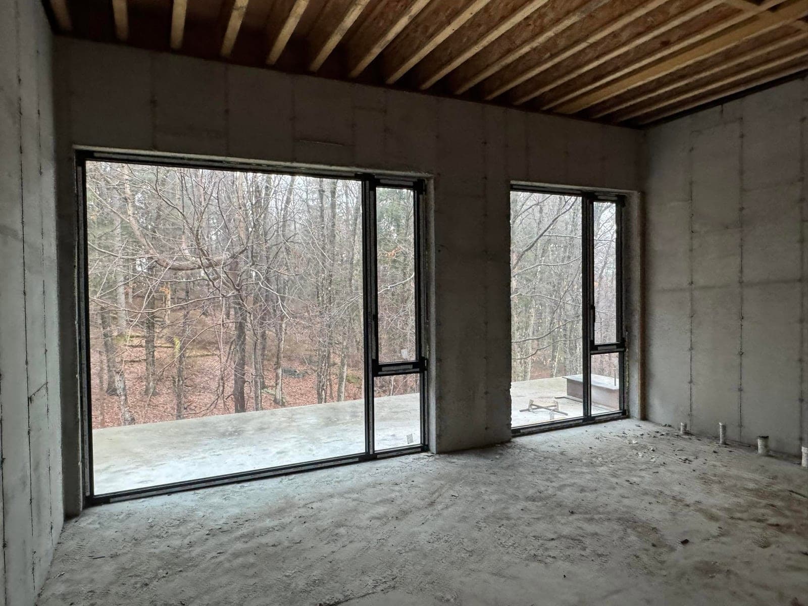 Large sliding glass patio doors opening onto a yard after service